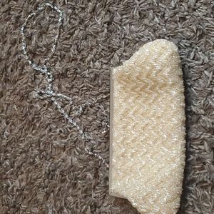 Mes Ami beaded ivory evening purse with chain strap.